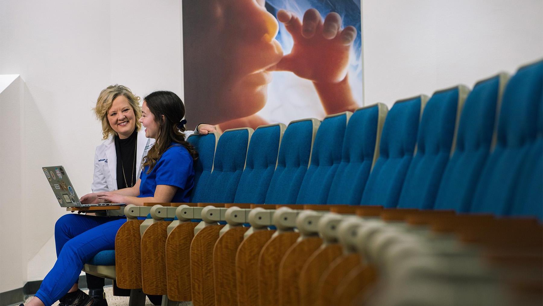 Nursing student and professor in the Simons Center